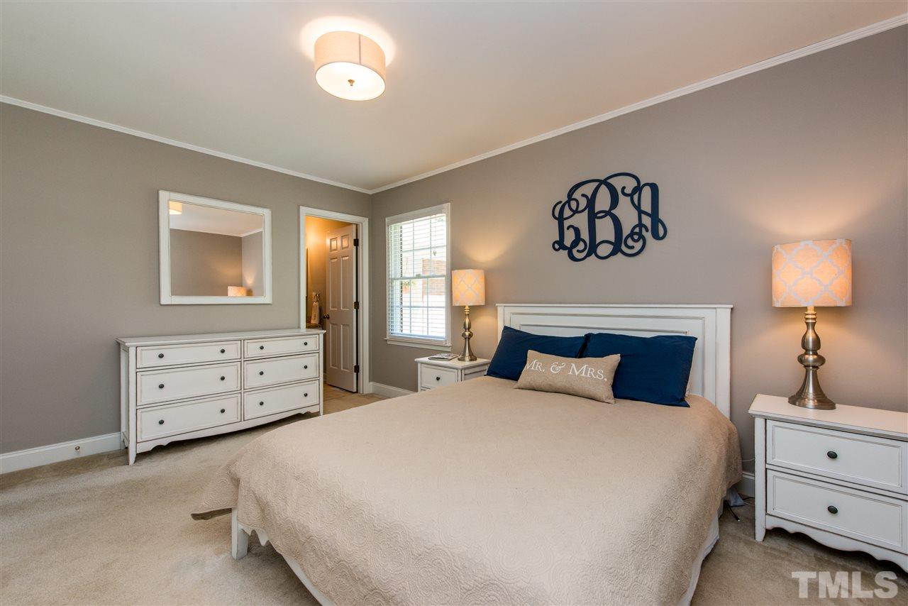 3512 Peach Haven Court Raleigh, NC 27607 - Photo 16 of 25 a bedroom with a bed and a dresser