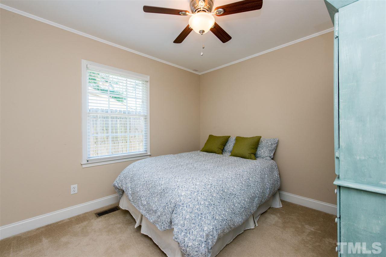 3512 Peach Haven Court Raleigh, NC 27607 - Photo 18 of 25 a bedroom with a bed and window
