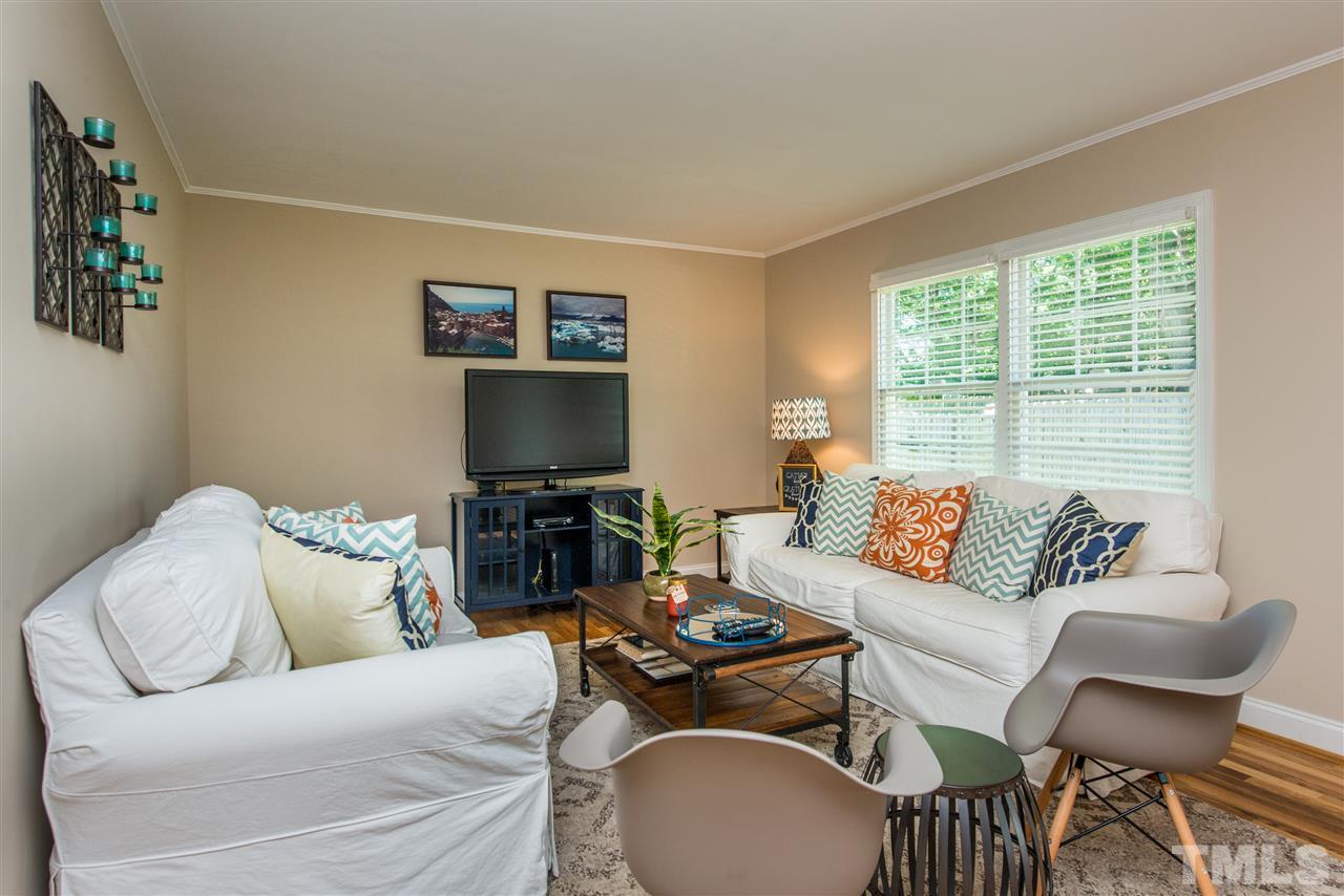 3512 Peach Haven Court Raleigh, NC 27607 - Photo 10 of 25 a living room with furniture and a flat screen tv