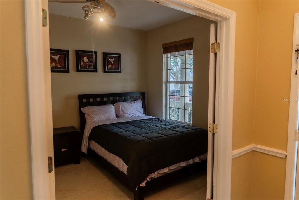 6673 Duncaster Street Windermere, FL 34786 - Photo 11 of 25 a bedroom with a bed and window