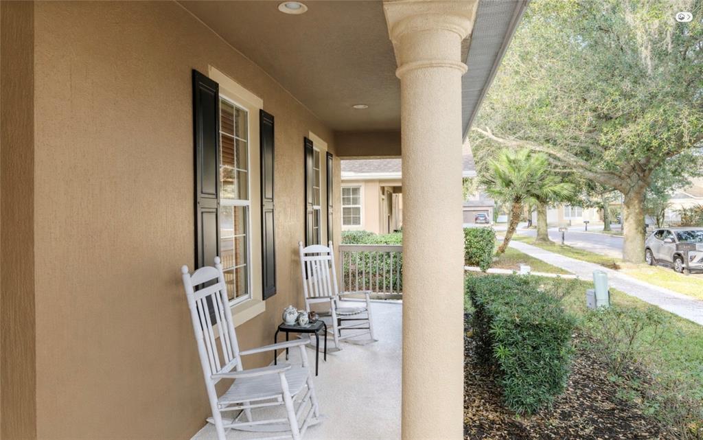 6673 Duncaster Street Windermere, FL 34786 - Photo 16 of 25 a porch with a table and chairs