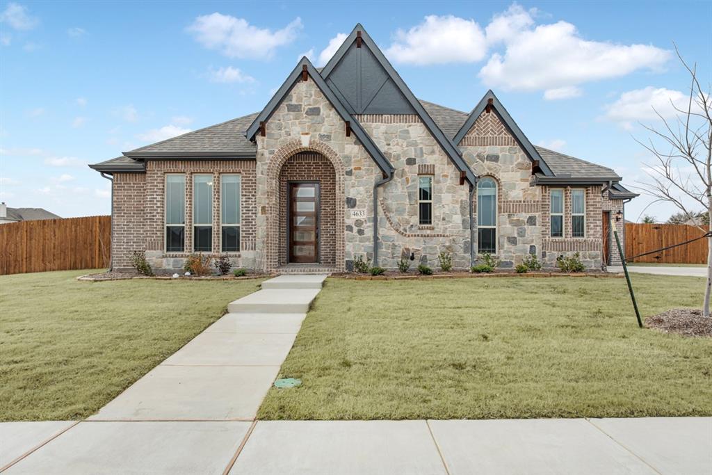 4633 Rawhide Trail Midlothian, TX 76065 - Photo 1 of 1 a front view of a house with garden