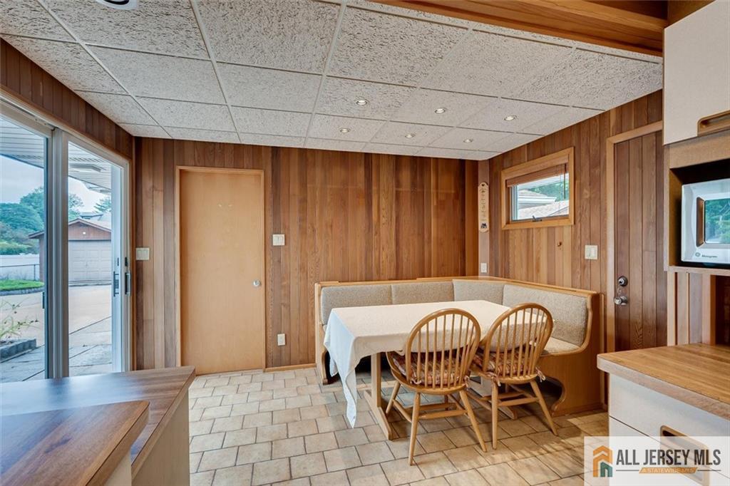 21 Tyndall Road Kendall Park, NJ 08824 - Photo 11 of 33 a view of a dining room with furniture and chandelier