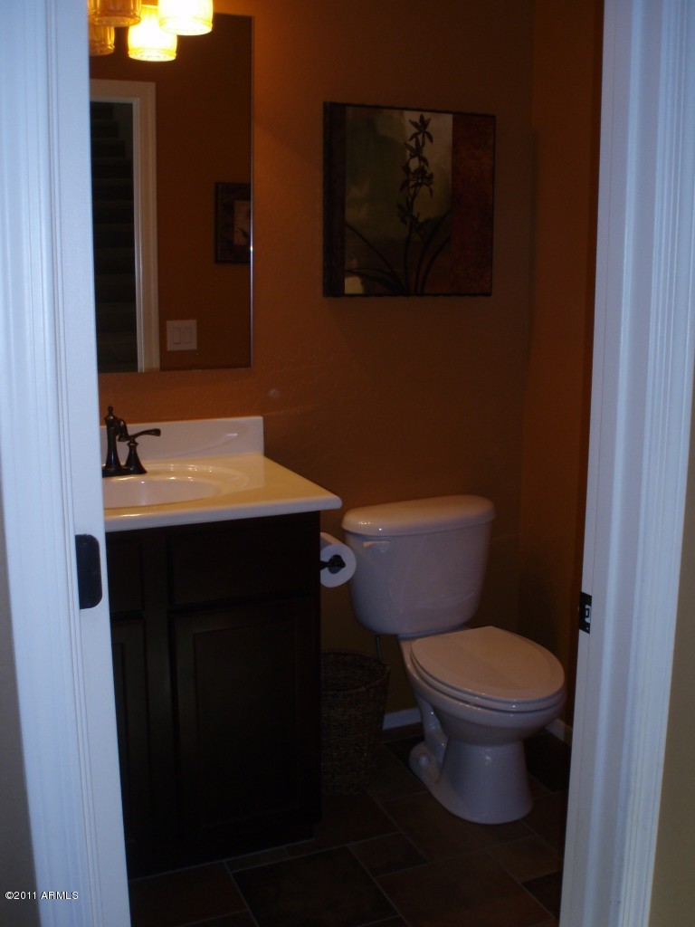 2933 East Blue Sage Road Gilbert, AZ 85297 - Photo 11 of 18 a bathroom with a toilet and a sink