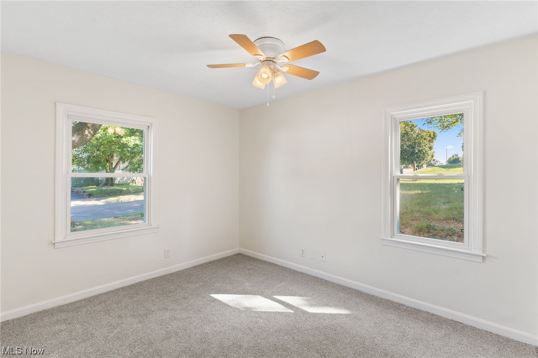 898 Reed Avenue Akron, OH 44306 - Photo 24 of 26 Carpeted spare room featuring plenty of natural light and ceiling fan