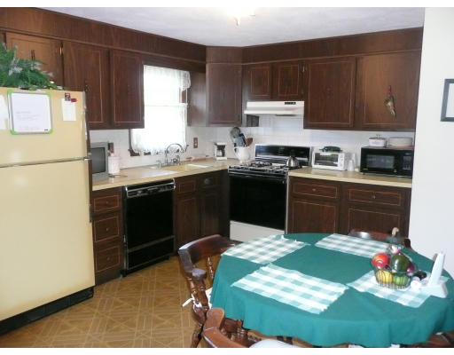 10 Winsor Road Billerica, MA 01821 - Photo 3 of 15 a kitchen with a sink cabinets and appliances