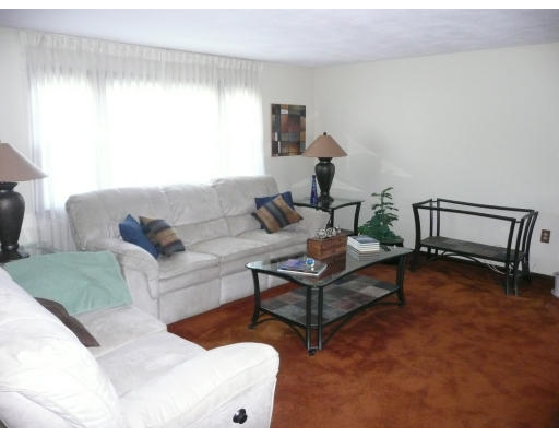 10 Winsor Road Billerica, MA 01821 - Photo 6 of 15 a living room with furniture and a table