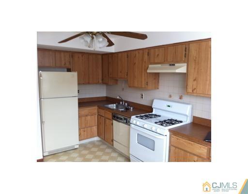 1916 Raspberry Court Edison, NJ 08817 - Photo 1 of 8 a kitchen with a stove and a refrigerator