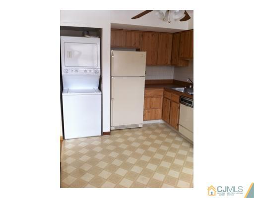 1916 Raspberry Court Edison, NJ 08817 - Photo 2 of 8 a kitchen with a refrigerator and a refrigerator