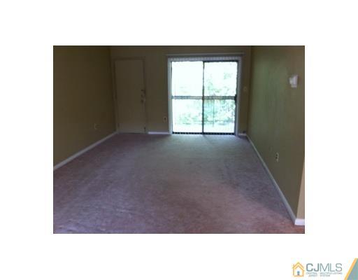 1916 Raspberry Court Edison, NJ 08817 - Photo 4 of 8 a view of an empty room with a window