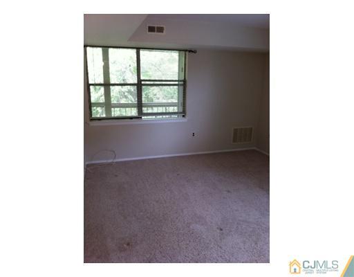 1916 Raspberry Court Edison, NJ 08817 - Photo 5 of 8 a view of an empty room with a window