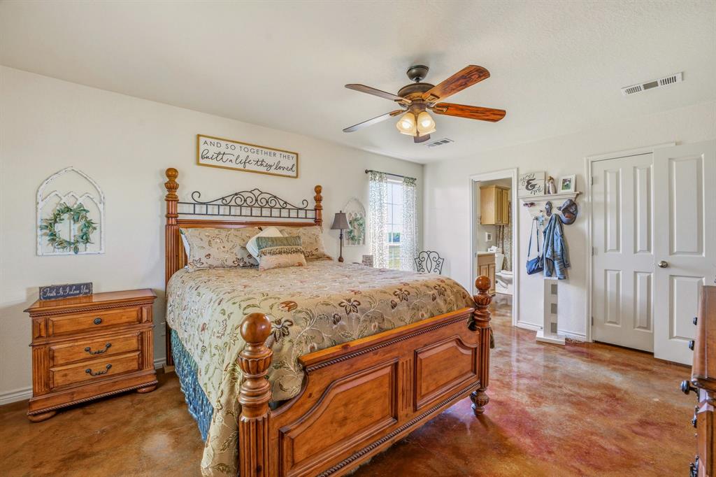 7915 East Fm 580 Kempner, TX 76539 - Photo 17 of 39 a bedroom with a bed and a chandelier