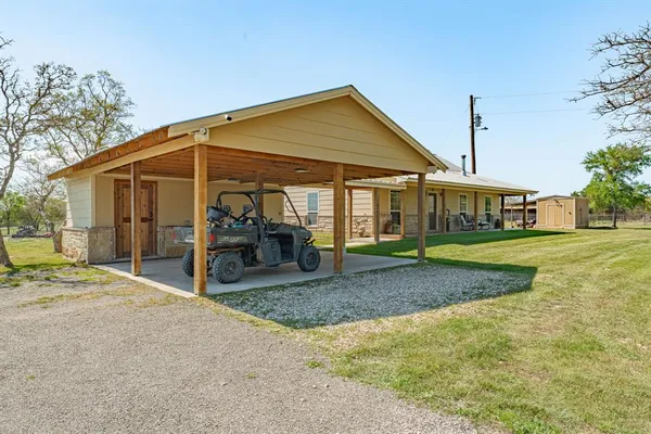 a view of a house with basketball court