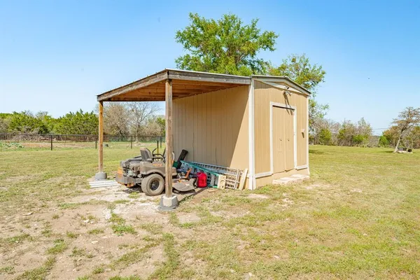 a view of backyard with trampoline