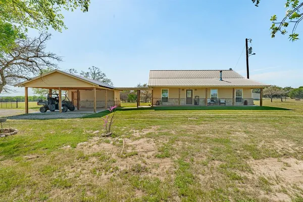 a view of a house with a big yard