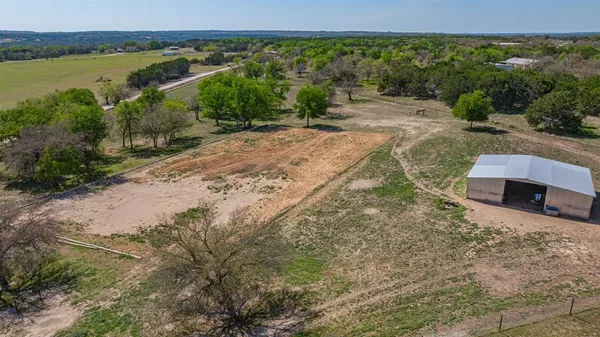 a view of a lake with beach and city view