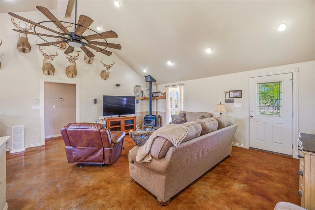 7915 East Fm 580 Kempner, TX 76539 - Photo 8 of 39 a living room with furniture a flat screen tv and a window