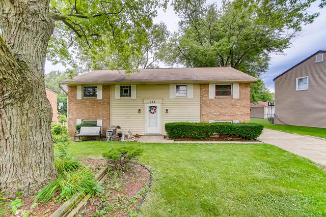 145 South Pinecrest Road Bolingbrook, IL 60440 - Photo 1 of 17 a front view of a house with a yard