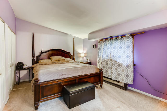 145 South Pinecrest Road Bolingbrook, IL 60440 - Photo 11 of 17 a bedroom with a bed and a dresser