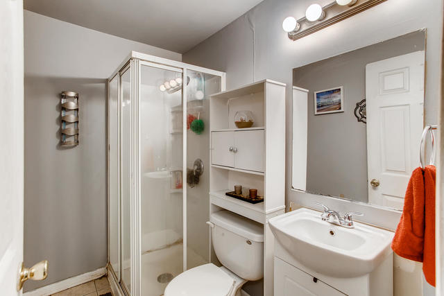 145 South Pinecrest Road Bolingbrook, IL 60440 - Photo 14 of 17 a bathroom with a sink toilet and shower