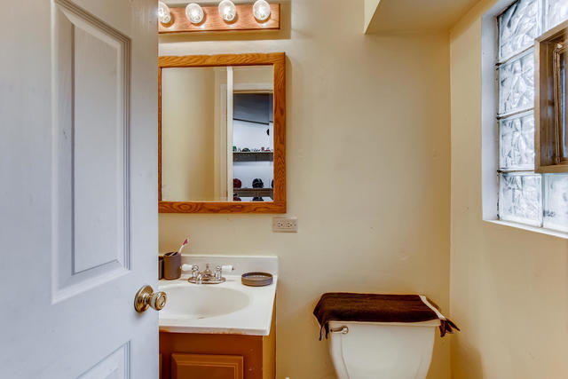 145 South Pinecrest Road Bolingbrook, IL 60440 - Photo 10 of 17 a bathroom with a sink and a mirror