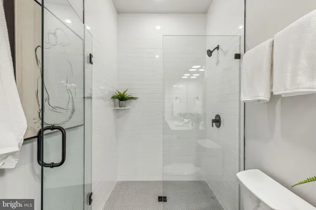 a bathroom with a shower and a shower