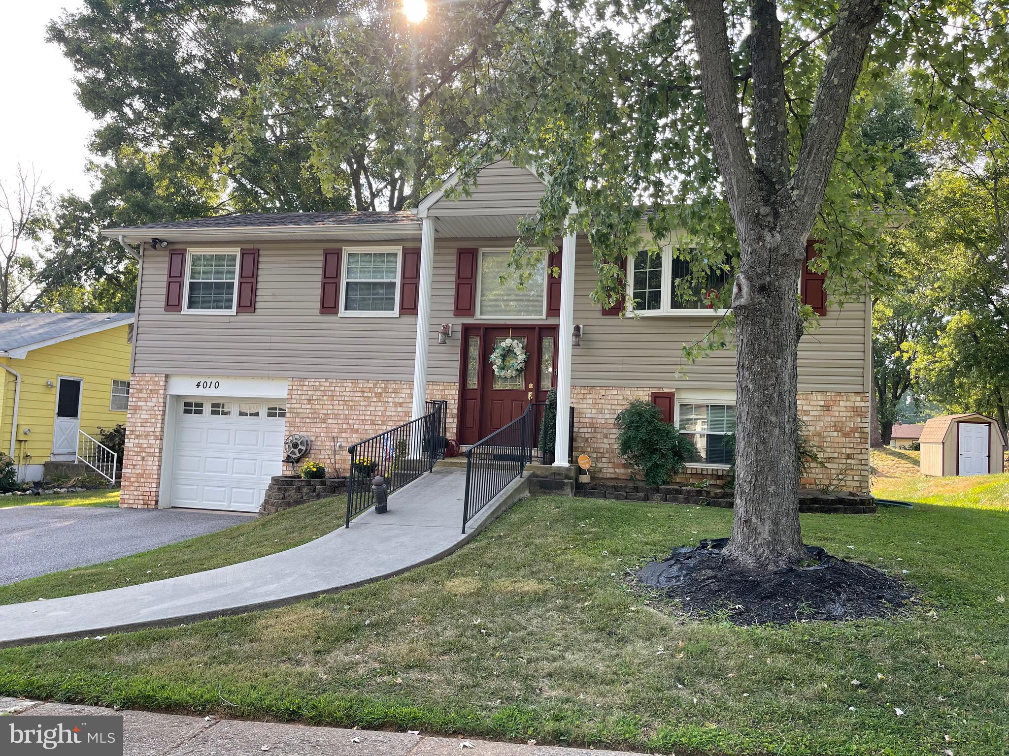4010 Winlee Road Randallstown, MD 21133 - Photo 1 of 41 a front view of a house with garden