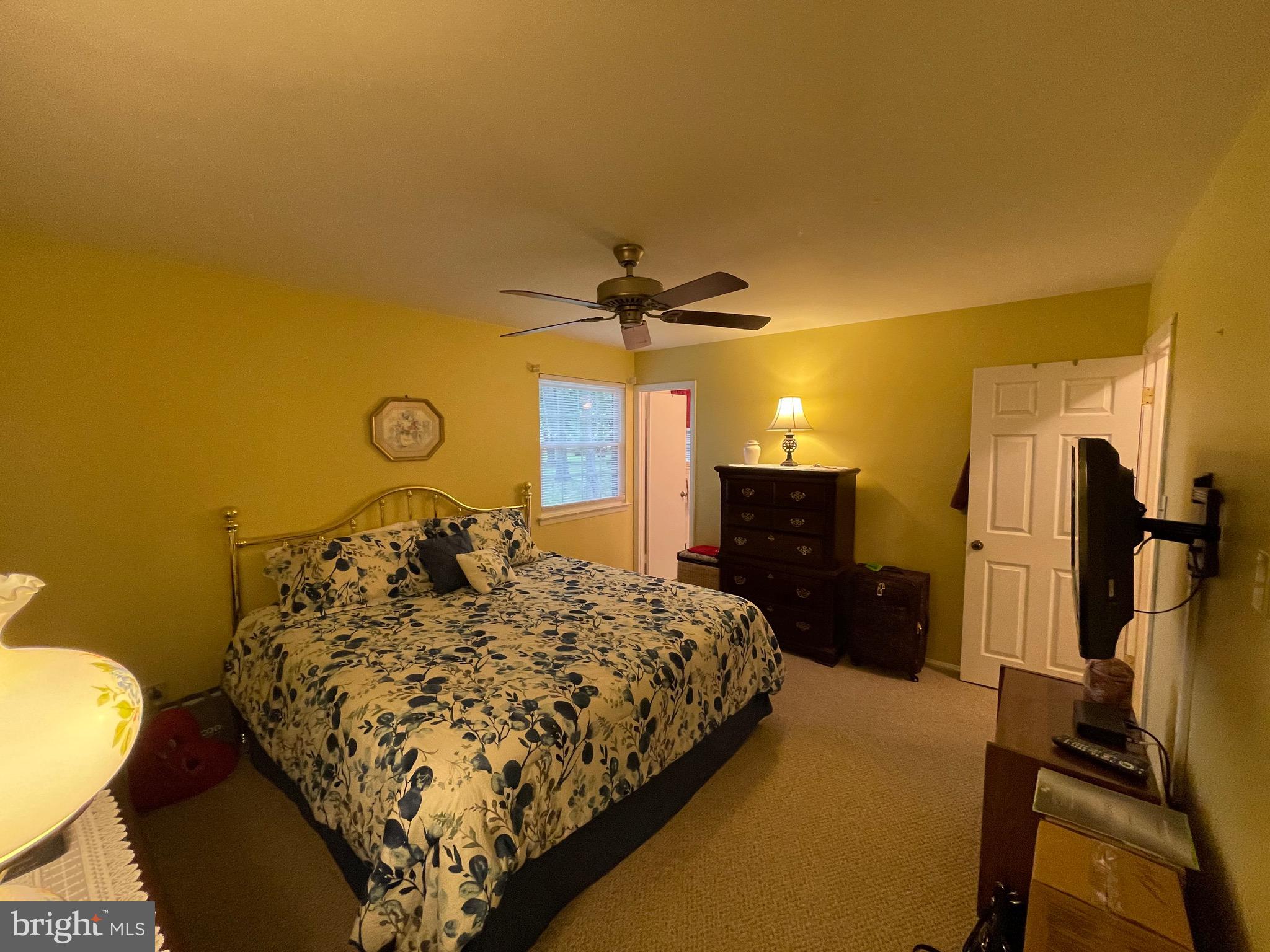 4010 Winlee Road Randallstown, MD 21133 - Photo 21 of 41 a bedroom with a bed and a chandelier