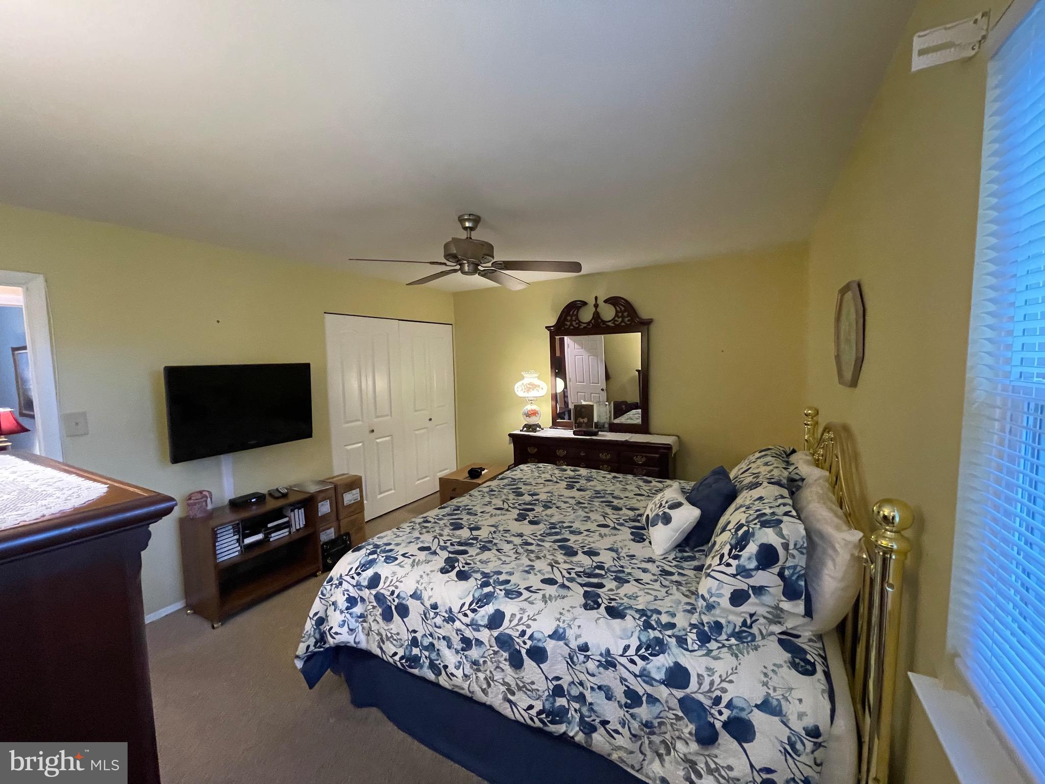 4010 Winlee Road Randallstown, MD 21133 - Photo 22 of 41 a bedroom with a bed and a flat tv screen on the dresser
