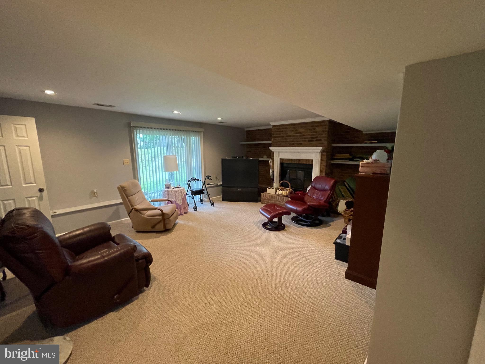 4010 Winlee Road Randallstown, MD 21133 - Photo 30 of 41 a living room with furniture and a gym cycle