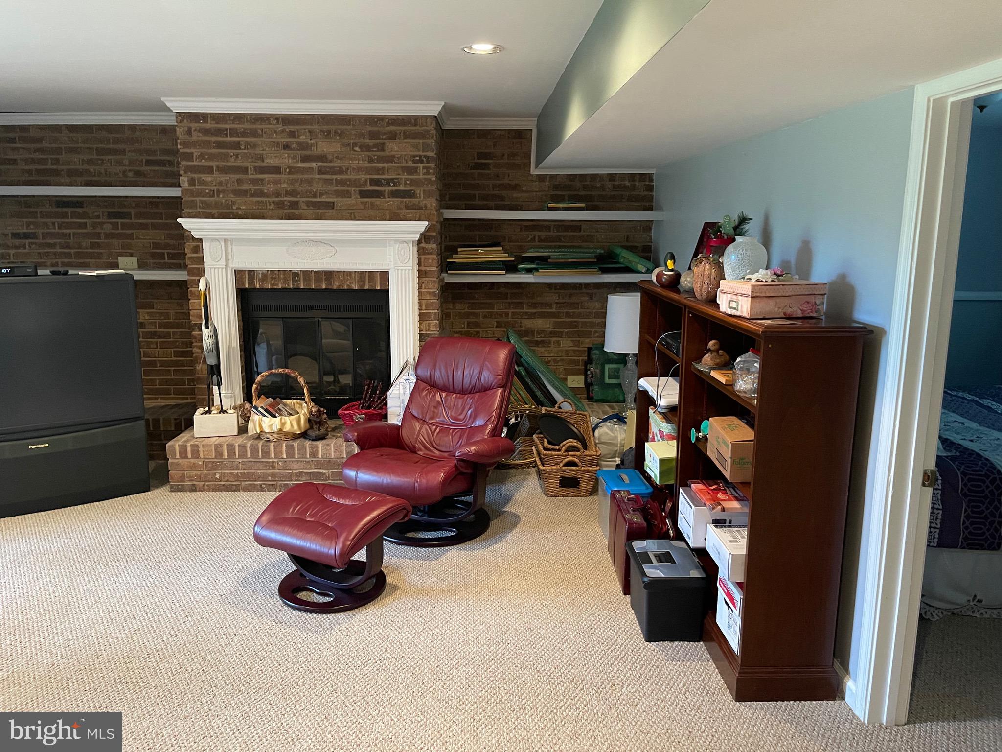 4010 Winlee Road Randallstown, MD 21133 - Photo 32 of 41 a living room with furniture and a fireplace