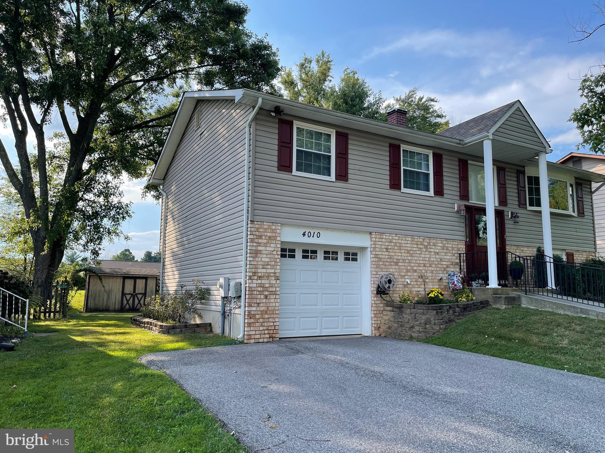 4010 Winlee Road Randallstown, MD 21133 - Photo 5 of 41 a view of a house with a swimming pool and a yard