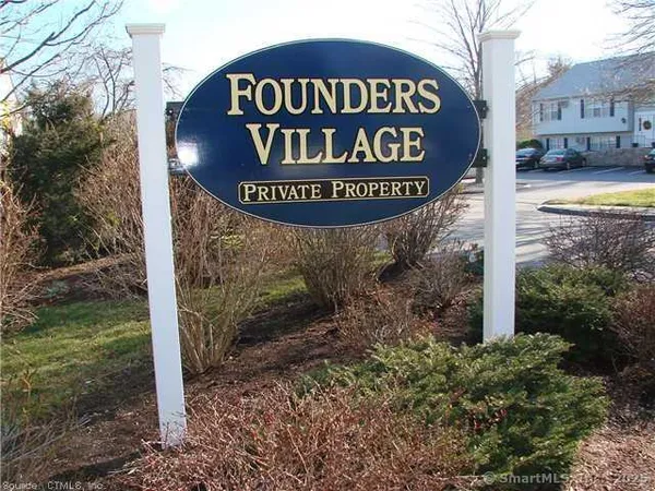 a sign broad in front of a road