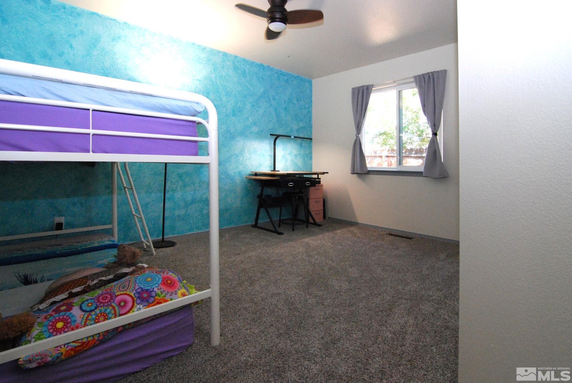 230 Whitaker Lane Fallon, NV 89406 - Photo 13 of 23 a room with window and couch