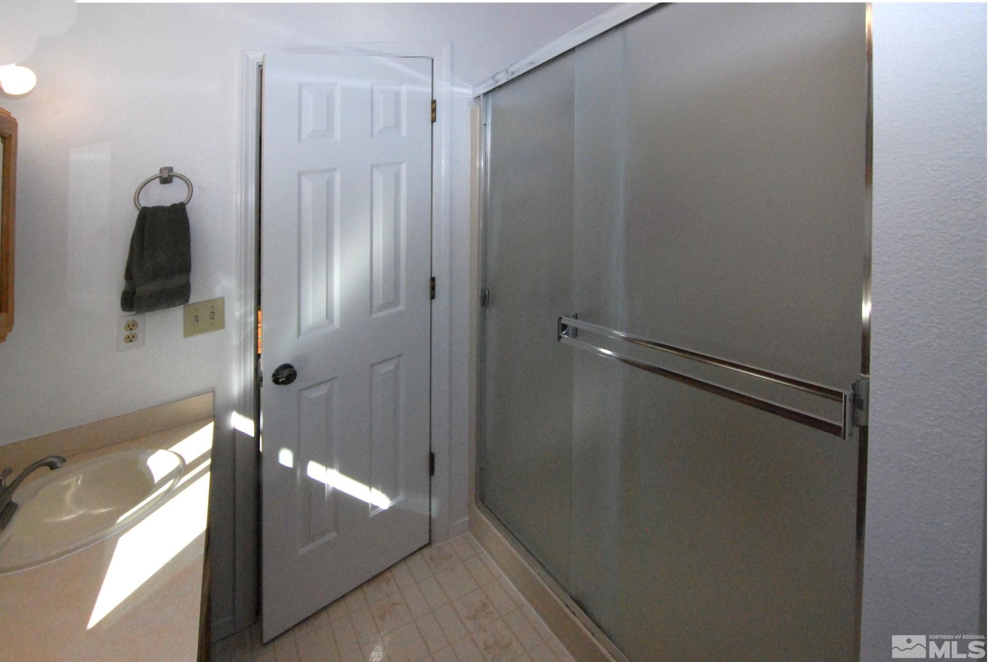 230 Whitaker Lane Fallon, NV 89406 - Photo 17 of 23 a bathroom with a shower and a sink