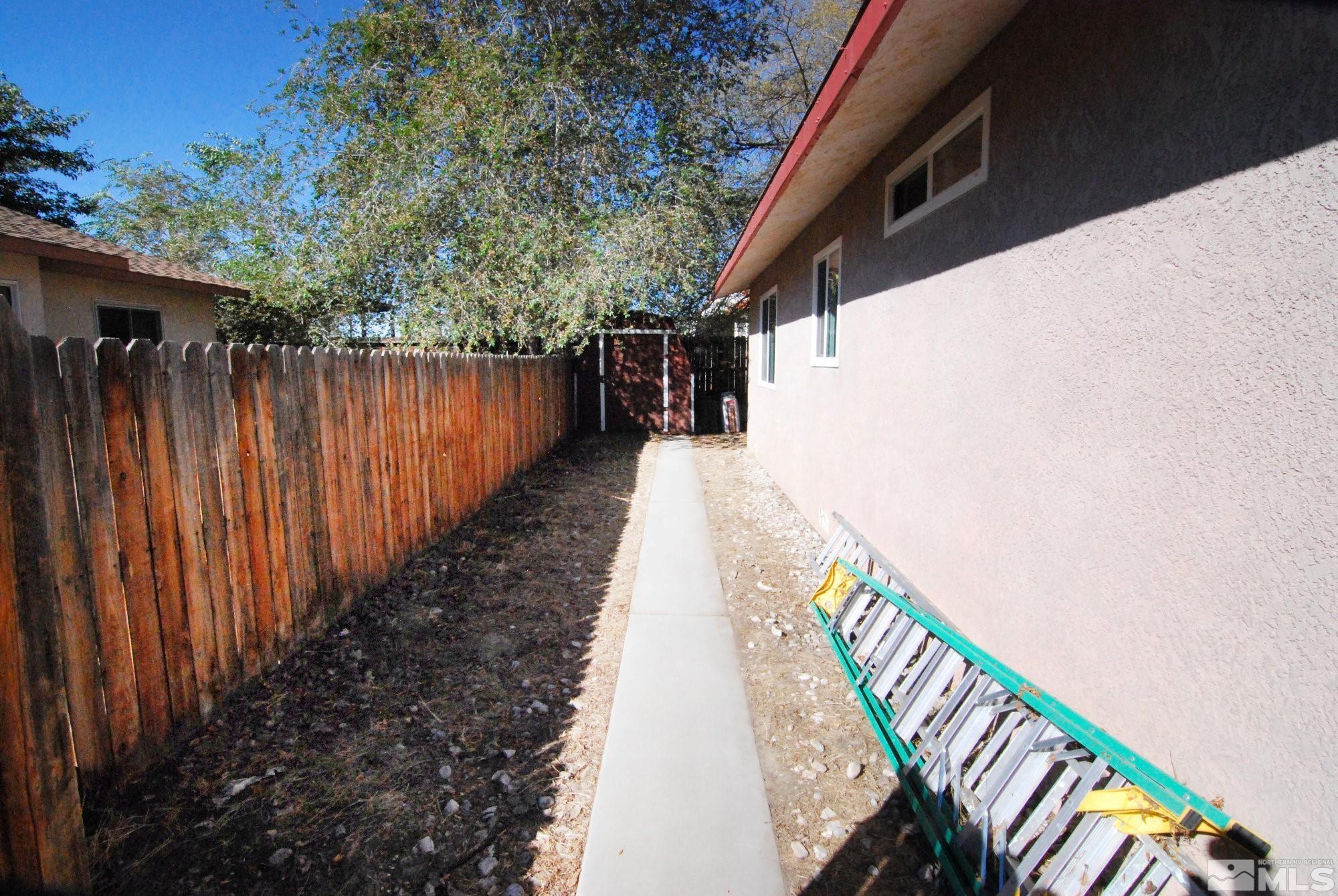 230 Whitaker Lane Fallon, NV 89406 - Photo 22 of 23 a balcony with wooden floor and fence in the back