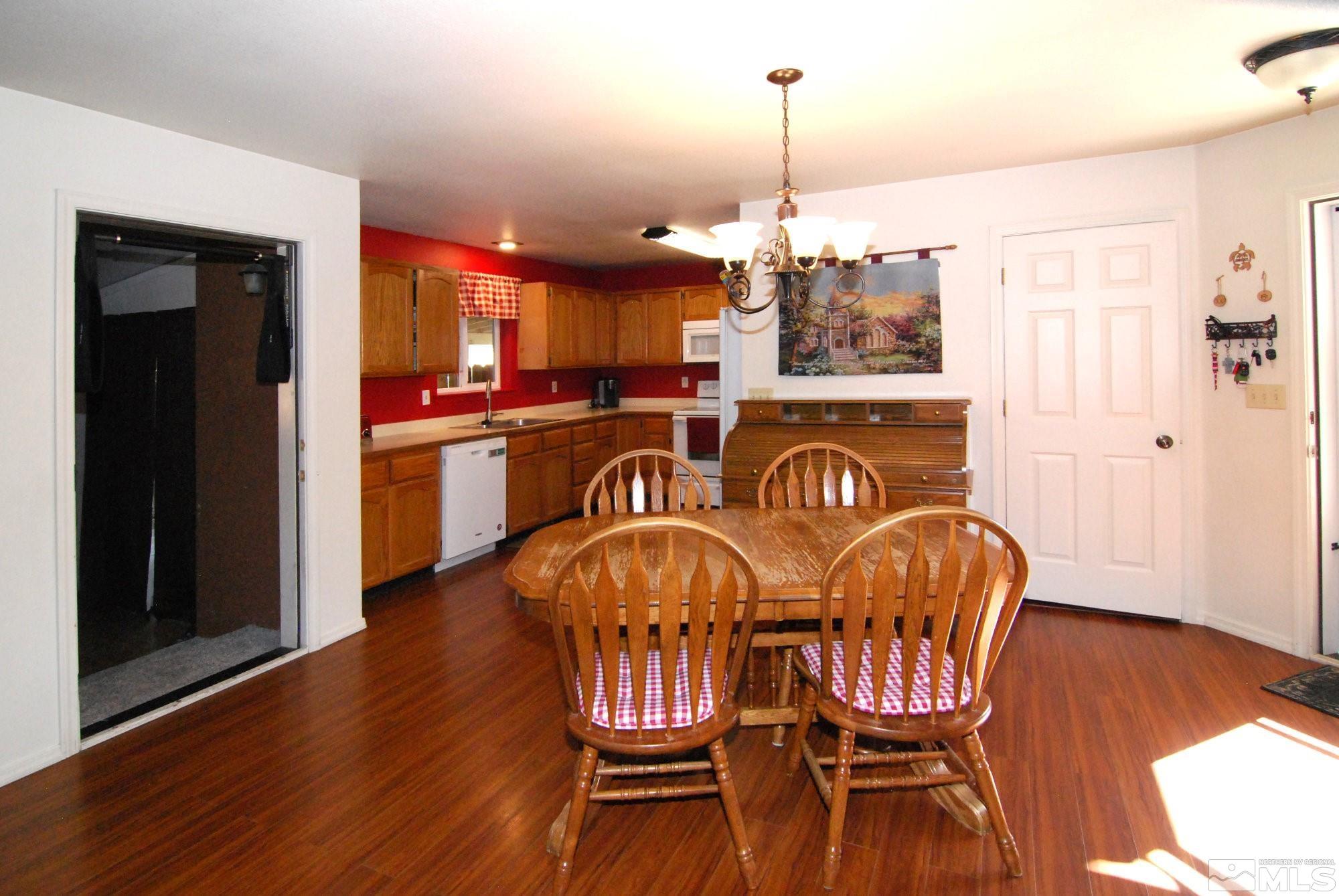 230 Whitaker Lane Fallon, NV 89406 - Photo 4 of 23 a view of a dining room with furniture window and wooden floor