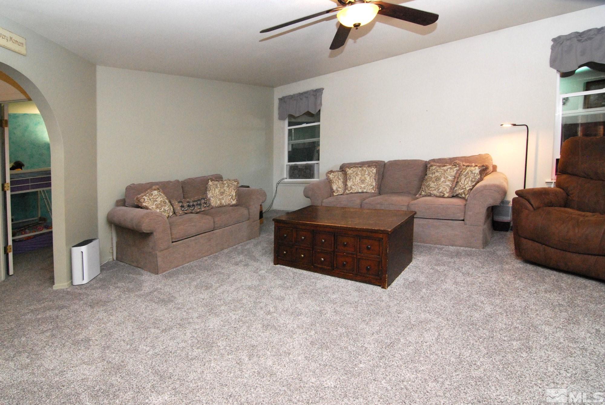 230 Whitaker Lane Fallon, NV 89406 - Photo 9 of 23 a living room with furniture and a couch