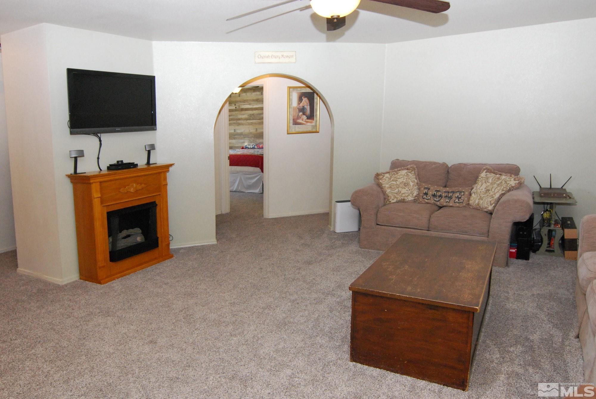 230 Whitaker Lane Fallon, NV 89406 - Photo 10 of 23 a living room with furniture and a flat screen tv