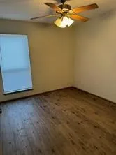 a view of a room with a empty space and a window