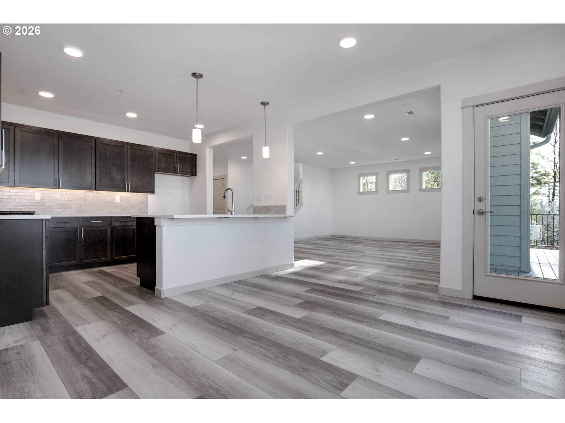 3714 Weldon Lane Eugene, OR 97403 - Photo 12 of 36 a view of kitchen and hall with wooden floor