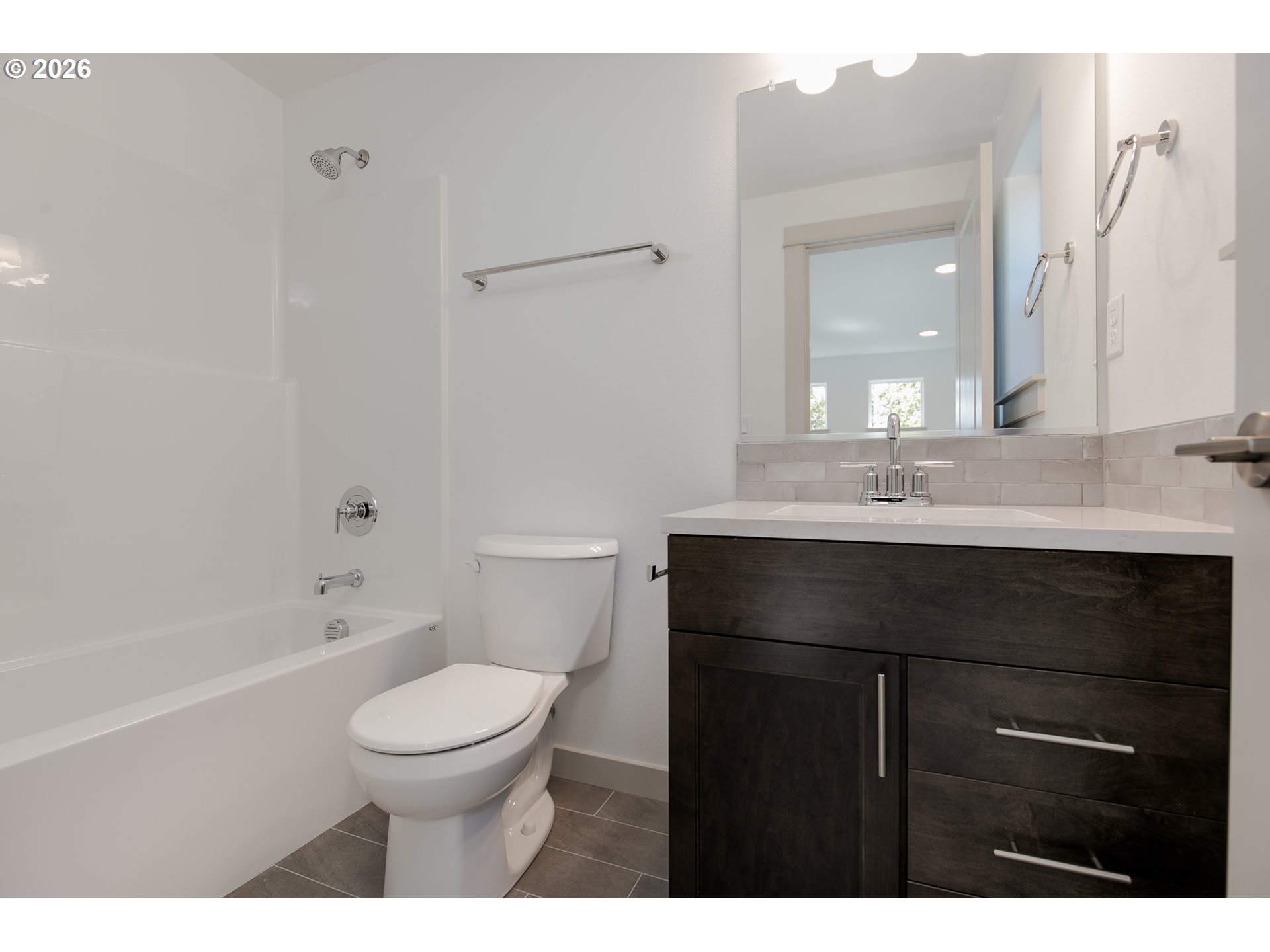 3714 Weldon Lane Eugene, OR 97403 - Photo 27 of 36 a bathroom with a sink a toilet a mirror and shower