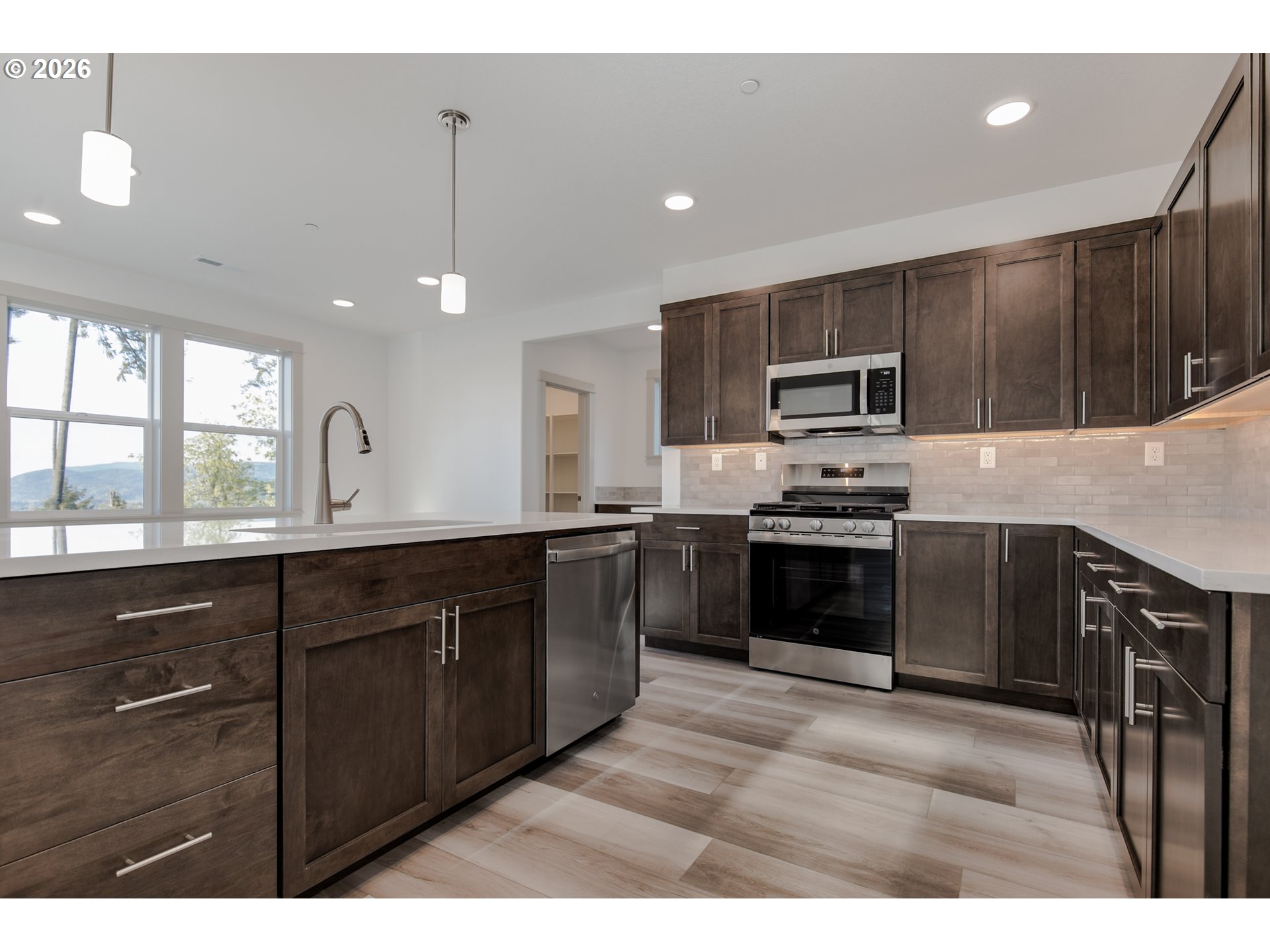 3714 Weldon Lane Eugene, OR 97403 - Photo 10 of 36 a kitchen with a sink cabinets and stainless steel appliances
