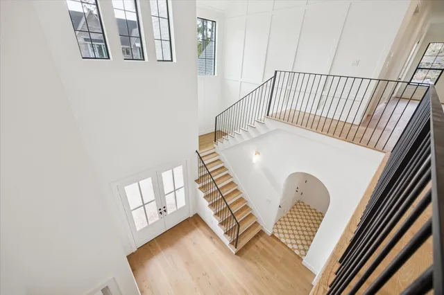 a living room with furniture a rug and a bookshelf