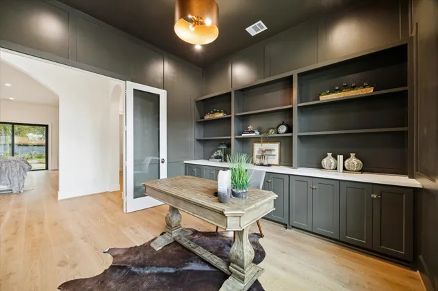 a large kitchen with stainless steel appliances kitchen island granite countertop a large island in the center