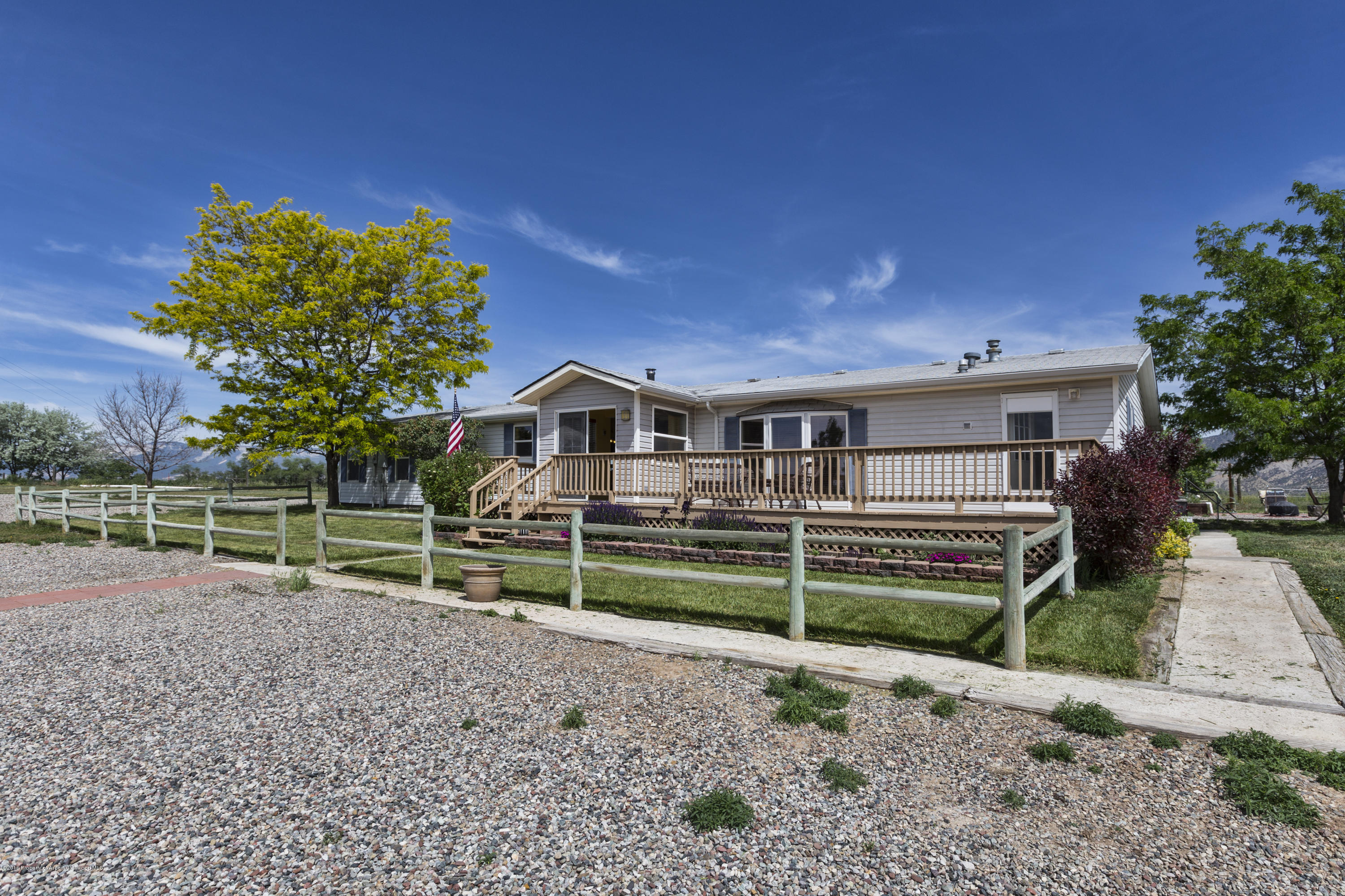 630 Lariat Road Silt, CO 81652 - Photo 1 of 21 a front view of a house with garden
