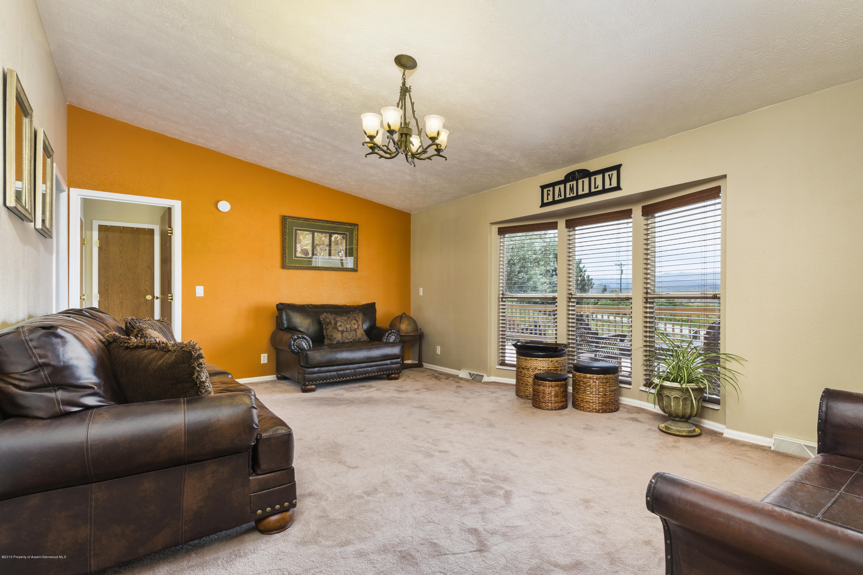 630 Lariat Road Silt, CO 81652 - Photo 16 of 21 a living room with furniture and a large window