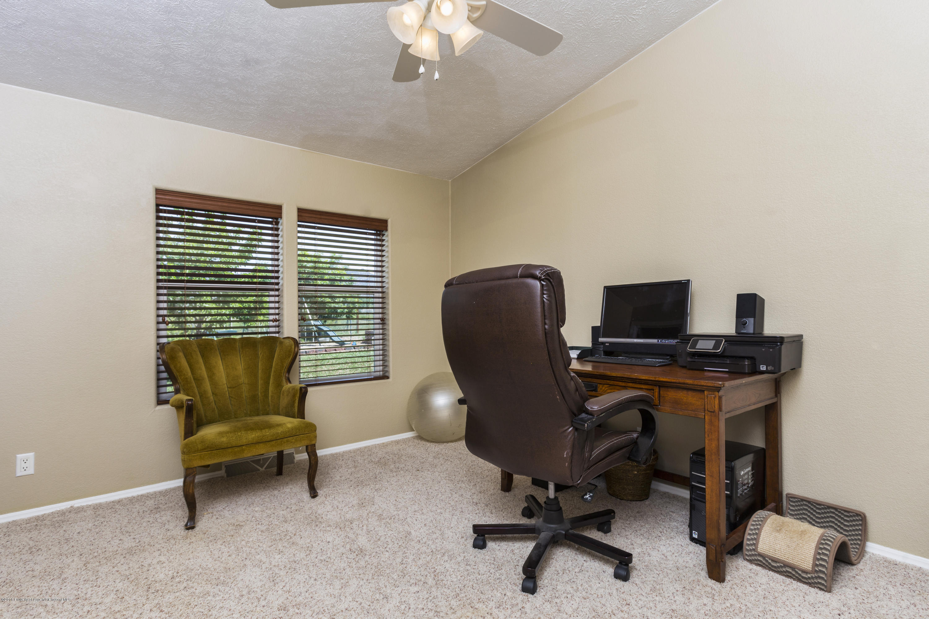 630 Lariat Road Silt, CO 81652 - Photo 19 of 21 a view of a workspace with furniture and a window