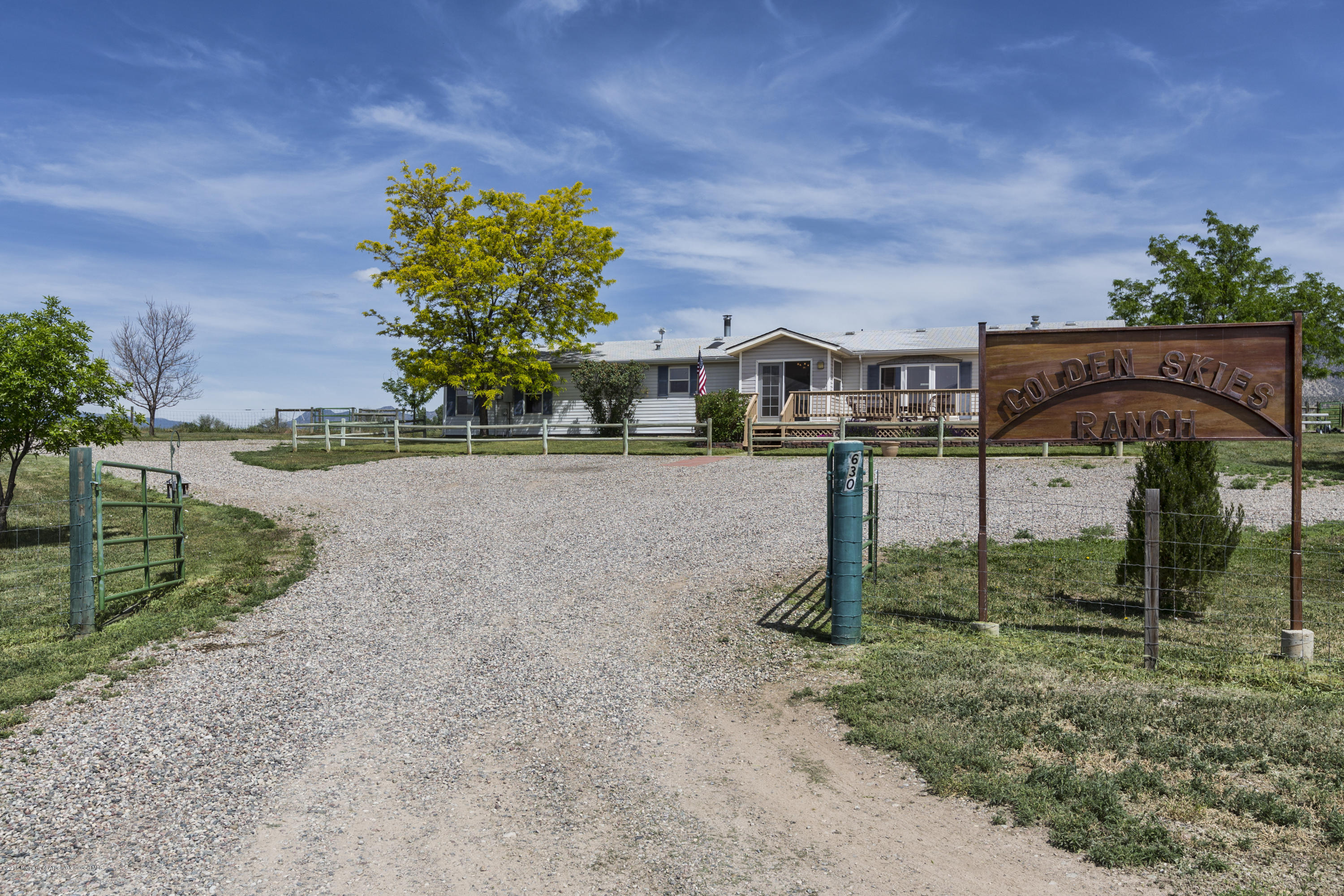 630 Lariat Road Silt, CO 81652 - Photo 3 of 21 a front view of a house with a yard
