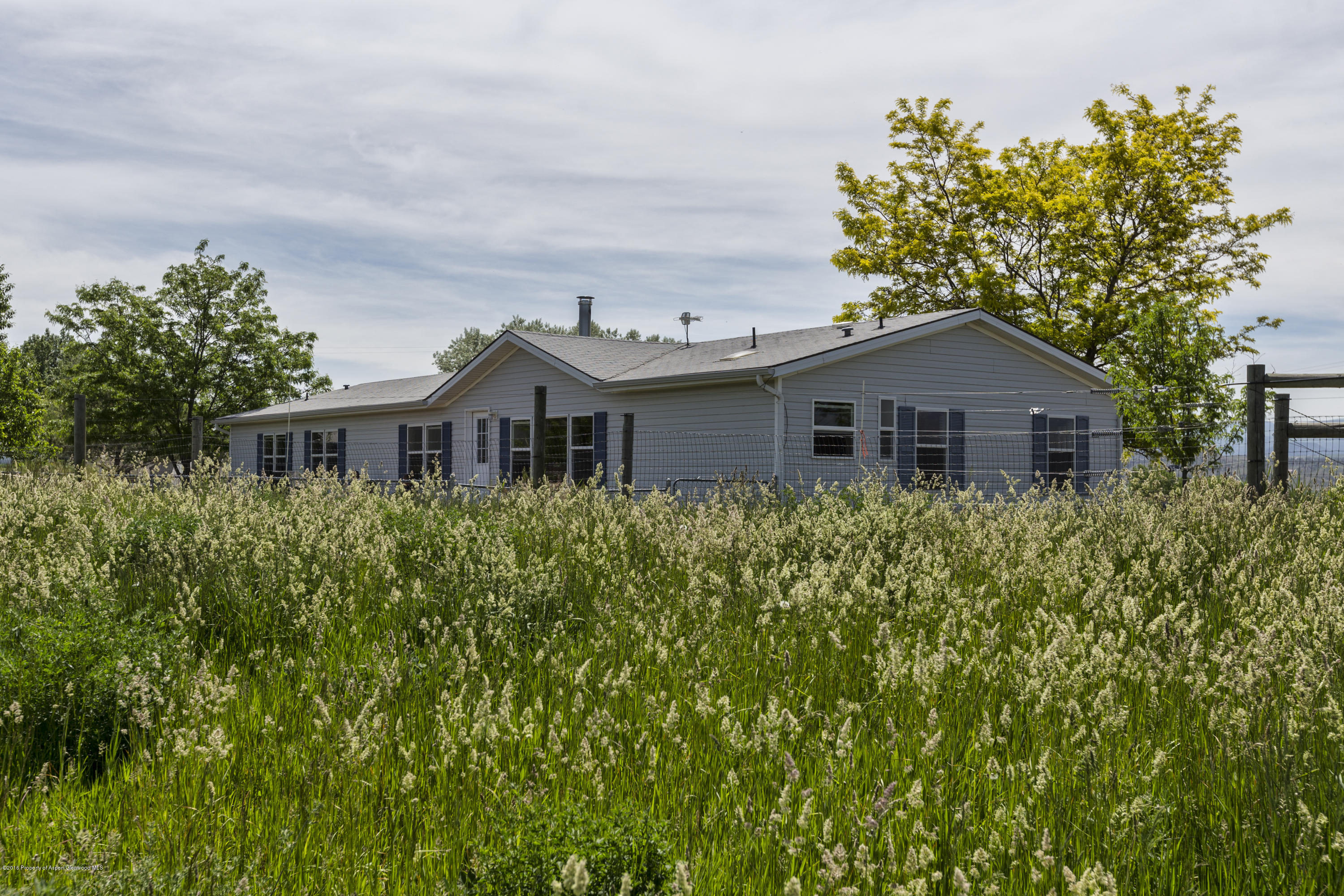 630 Lariat Road Silt, CO 81652 - Photo 8 of 21 a aerial view of a house with a yard and potted plants